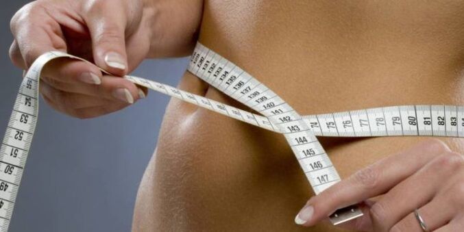 measuring the waist while losing weight